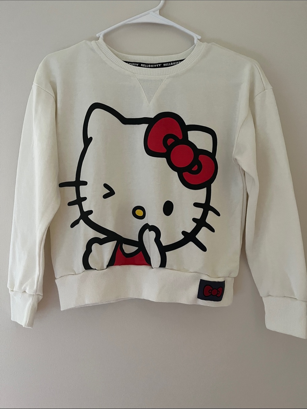 Hello Kitty Cream Sweatshirt with Red Bow Accent